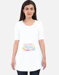 White maternity tunic dress, scoop neck, 3/4 sleeves, “Our Little Blessing” print