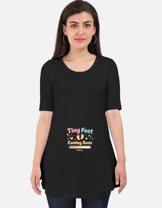 Black maternity T-shirt dress with short sleeves and 'Tiny Feet Coming Soon' print
