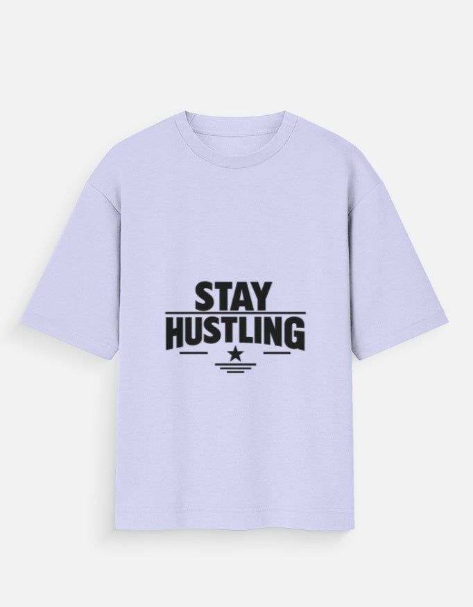 Oversized crew-neck T-shirt in lavender, short sleeves, front graphic text “STAY HUSTLING”