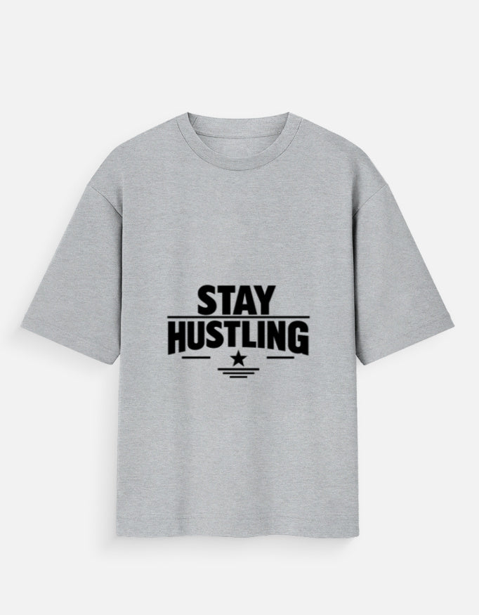 Oversized crew-neck T-shirt in grey melange, short sleeves, front graphic text “STAY HUSTLING”