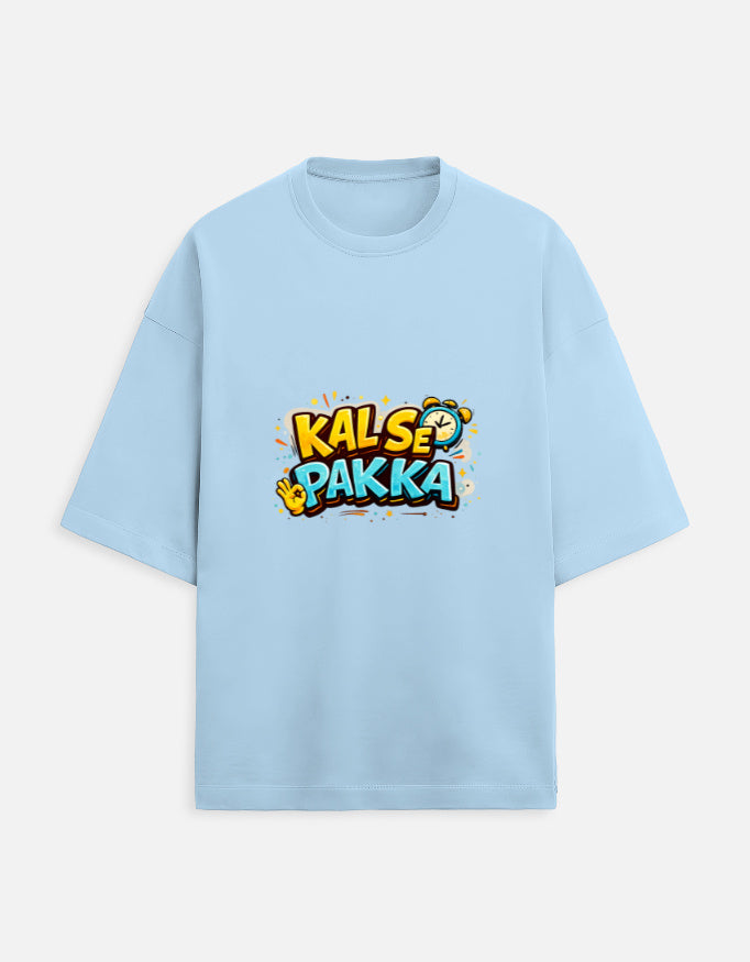 Unisex terry oversized tee, baby blue, front “KAL’S E PAKKA” graphic print