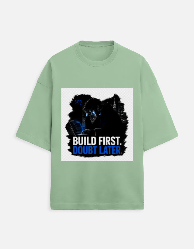 Unisex oversized terry tee in light green, crew neck, front graphic print.